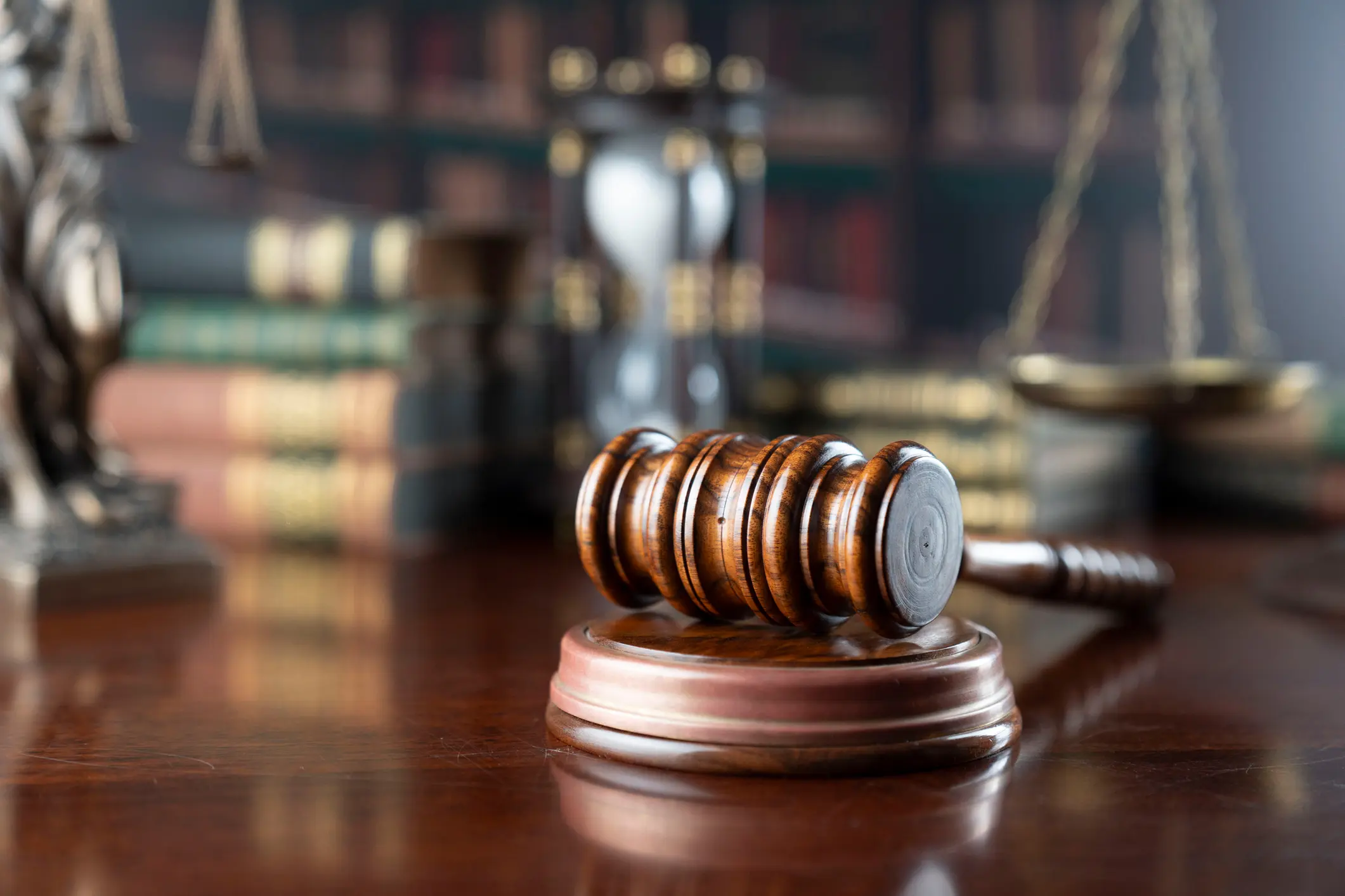 Judge's gavel with legal books